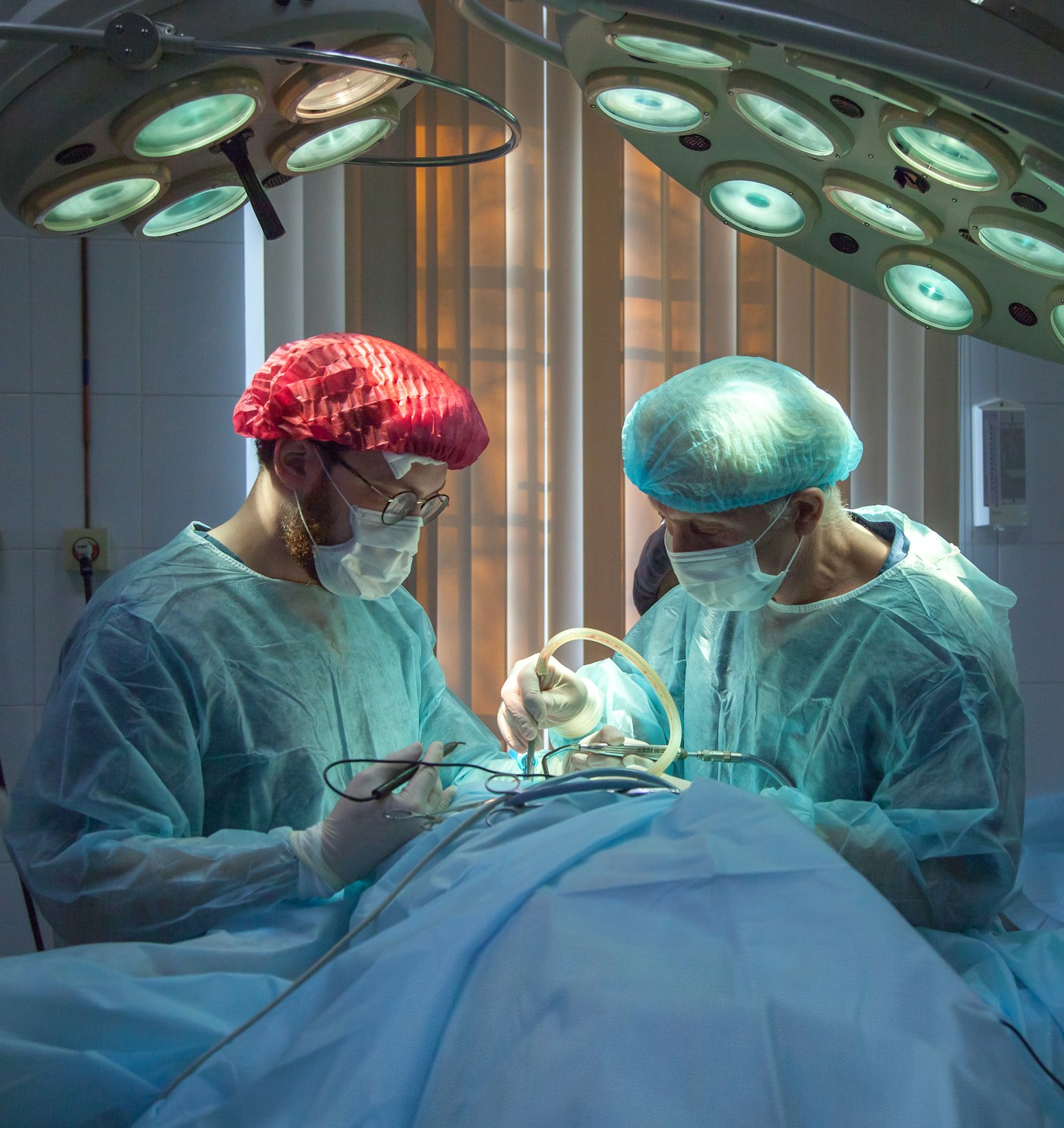 Surgeons working in an operating theatre